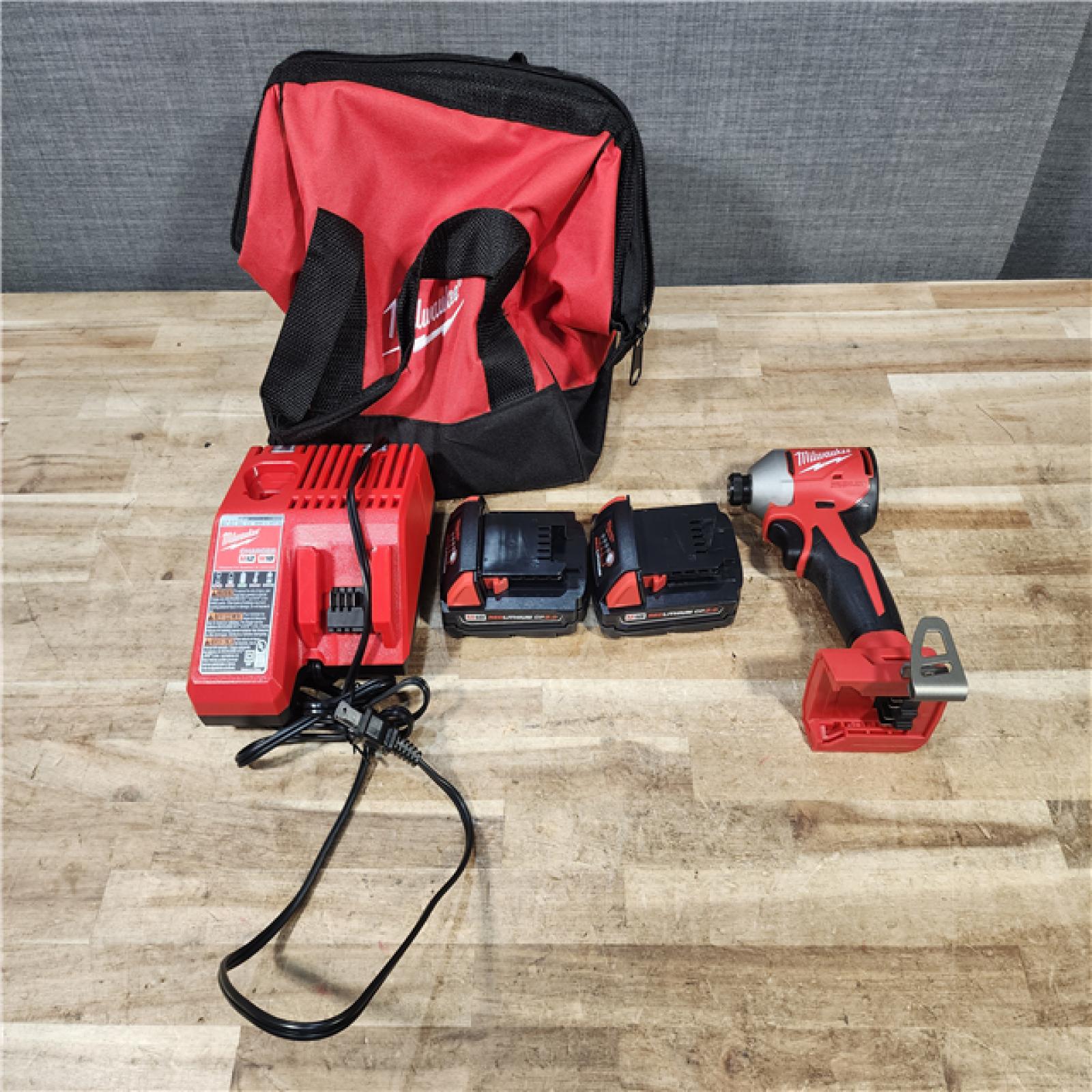 HOUSTON LOCATION - AS - IS Milwaukee 18-Volt Lithium-Ion Compact Brushless Cordless 1/4 in. Impact Driver Kit