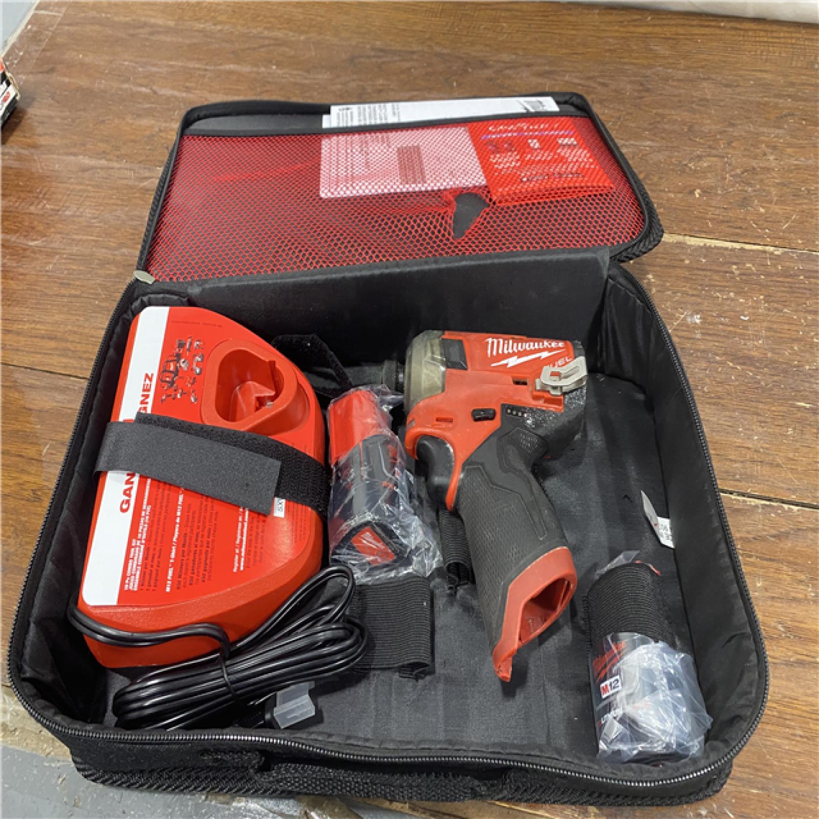 AS-IS M12 FUEL SURGE 12V Lithium-Ion Brushless Cordless 1/4 in. Hex Impact Driver Compact Kit W/Two 2.0Ah Batteries, Bag