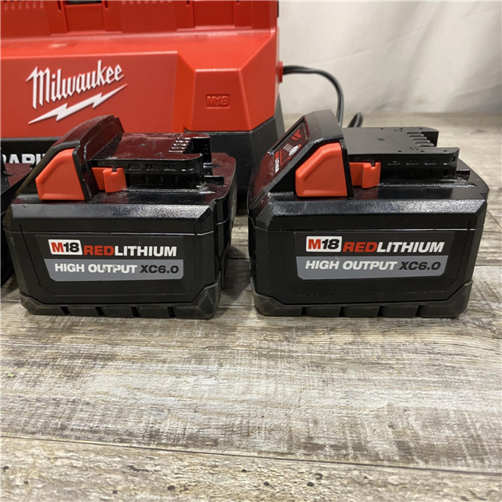 AS-IS Milwaukee 18-Volt Lithium-Ion Battery Pack (2) 5.0Ah and High Output Battery Pack (2) 6.0Ah with PACKOUT 6-Port Rapid Charger