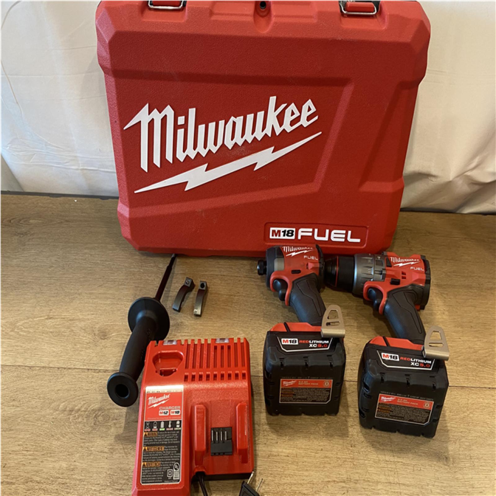 AS-IS Milwaukee FUEL 18V Lithium-Ion Brushless Cordless Hammer Drill and Impact Driver Combo Kit