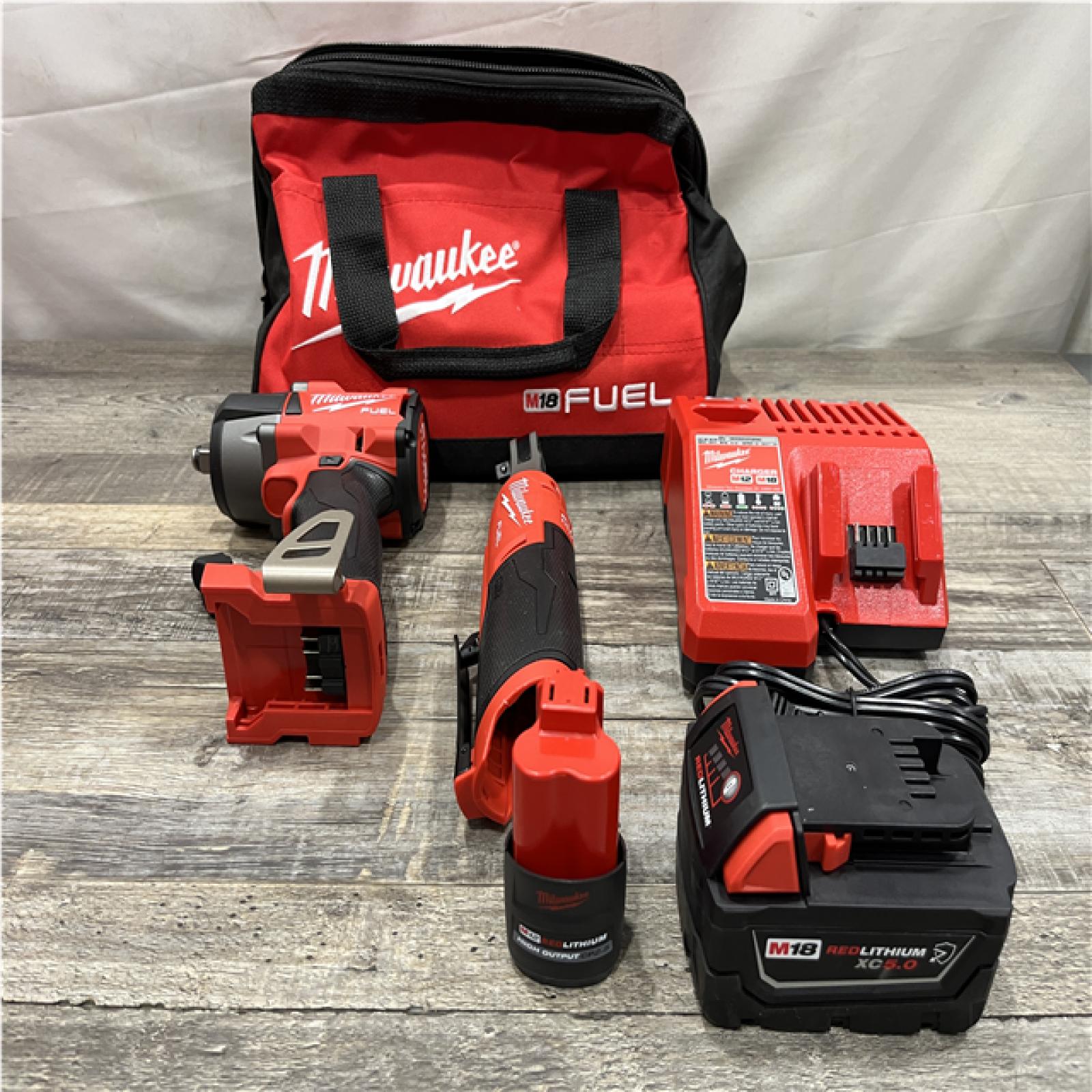 AS-IS Milwaukee FUEL 18V Cordless Mid Torque 1/2 in. Impact Wrench w/ 12 FUEL 3/8 in. Ratchet Combo Kit