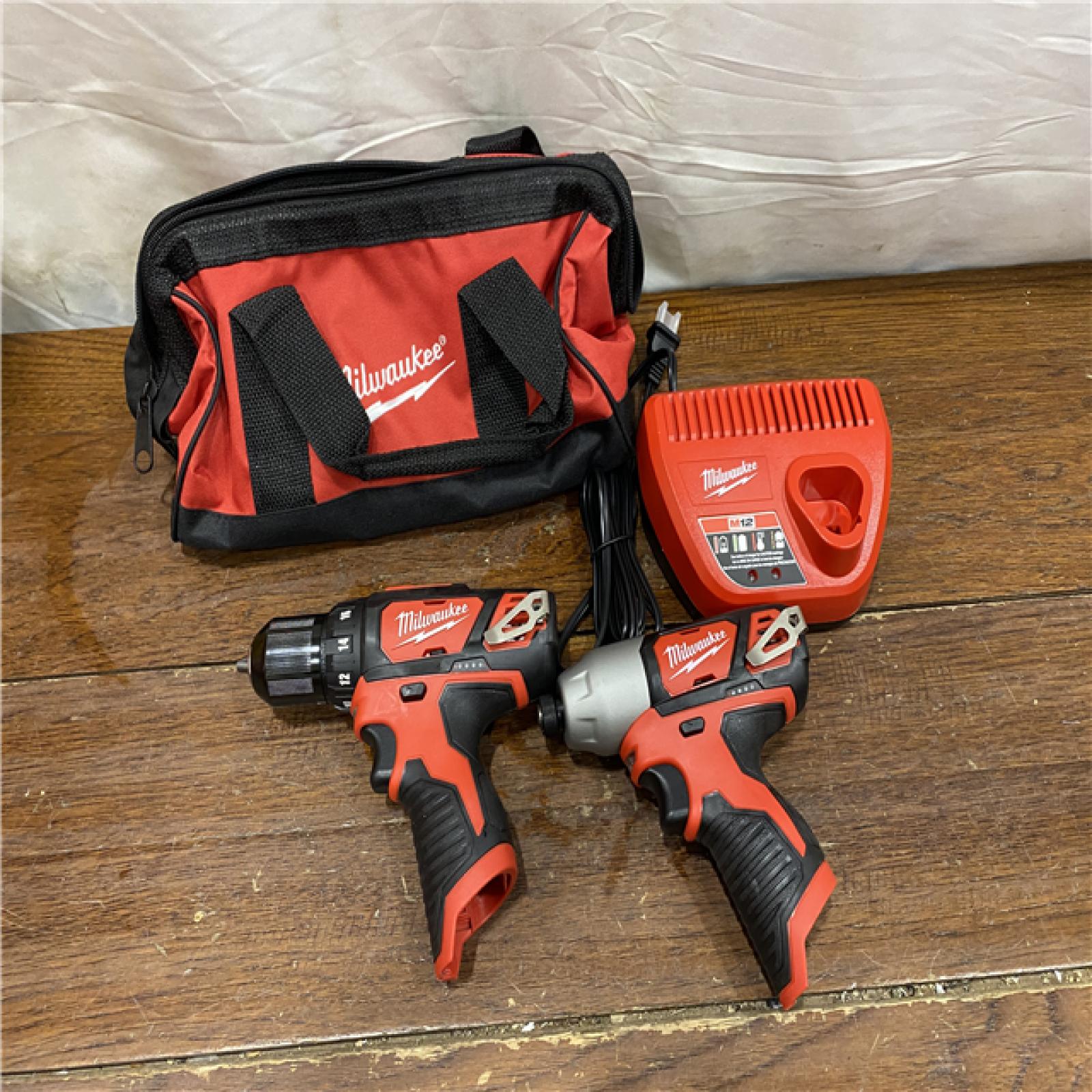 AS-IS  Milwaukee M12 12V Lithium-Ion Cordless Drill Driver/Impact Driver Combo Kit with Two 1.5Ah Batteries, Charger and Bag (2-Tool)