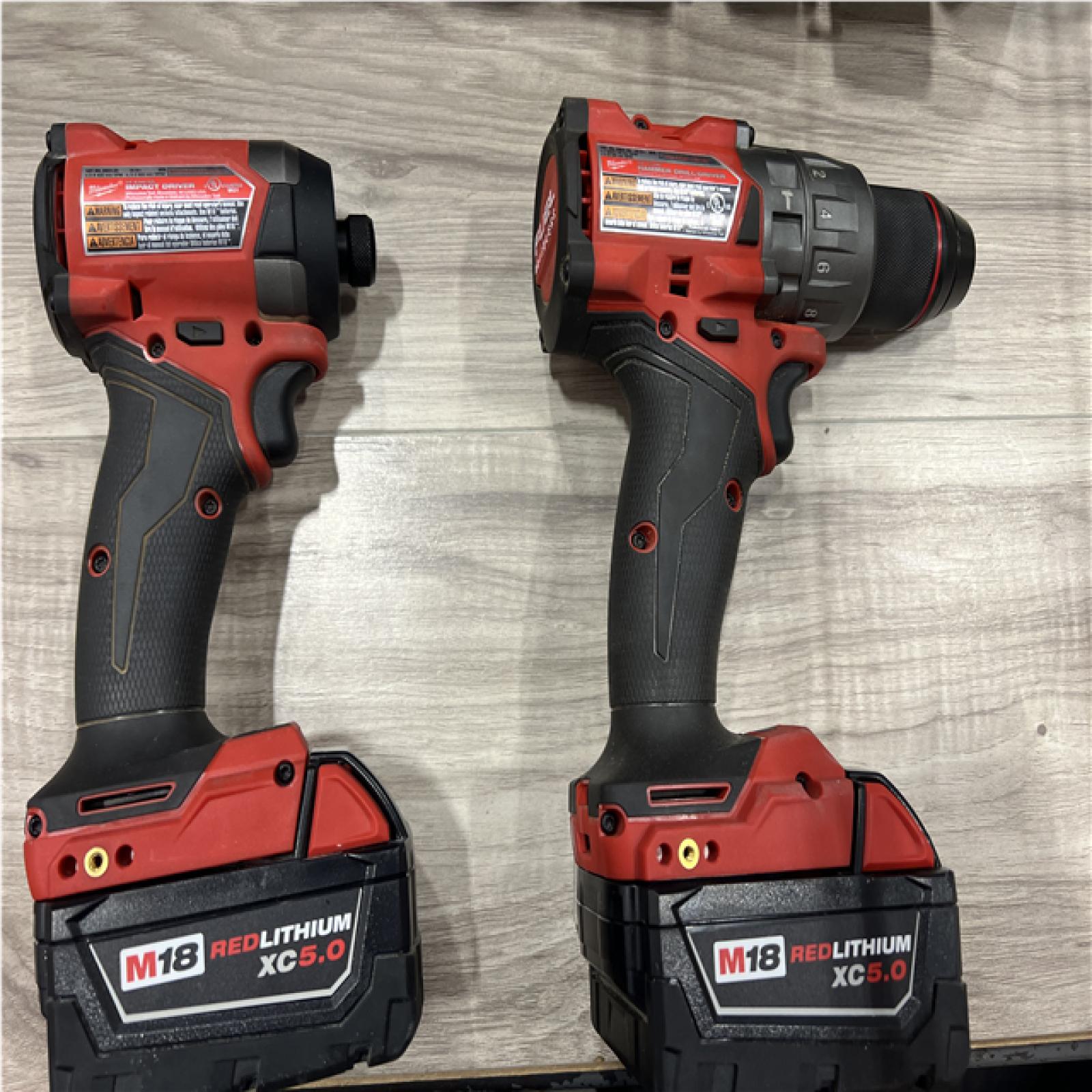 AS-IS Milwaukee FUEL 18V Lithium-Ion Brushless Cordless Hammer Drill and Impact Driver Combo Kit