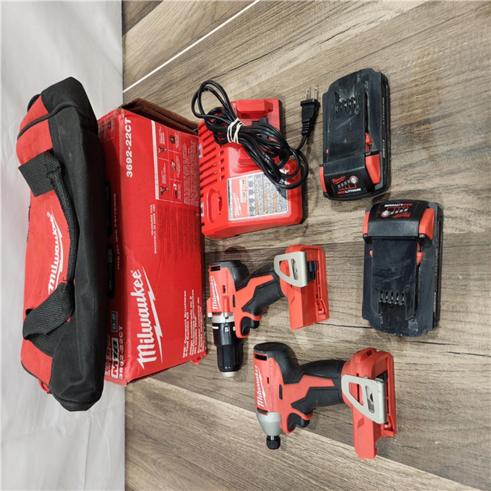 AS-IS  Milwaukee M18 18V Lithium-Ion Brushless Cordless Compact Drill/Impact Combo Kit (2-Tool) W/(2) 2.0 Ah Batteries, Charger & Bag