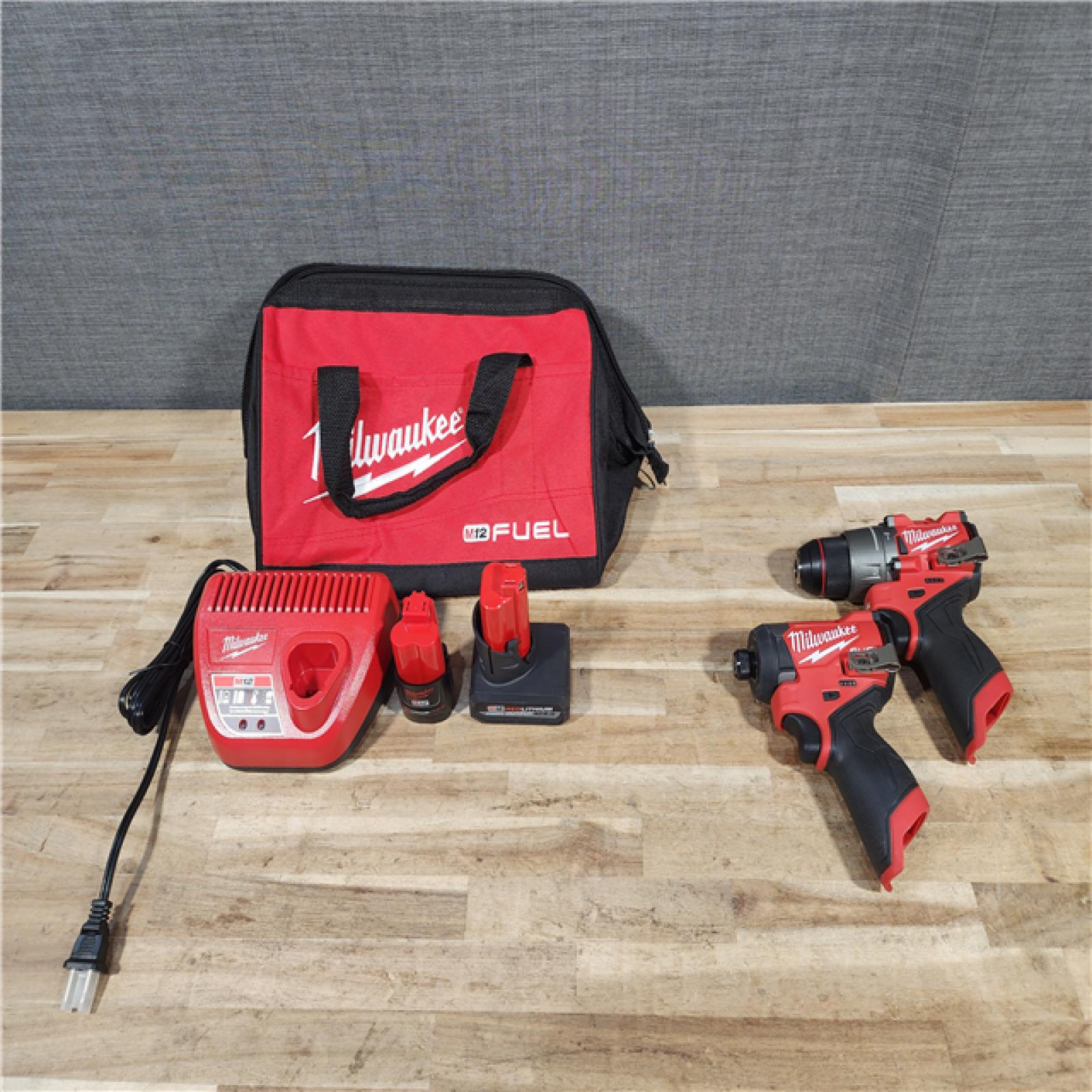 HOUSTON LOCATION - AS-IS Milwaukee FUEL 12-Volt Lithium-Ion Brushless Cordless Hammer Drill and Impact Driver Combo Kit