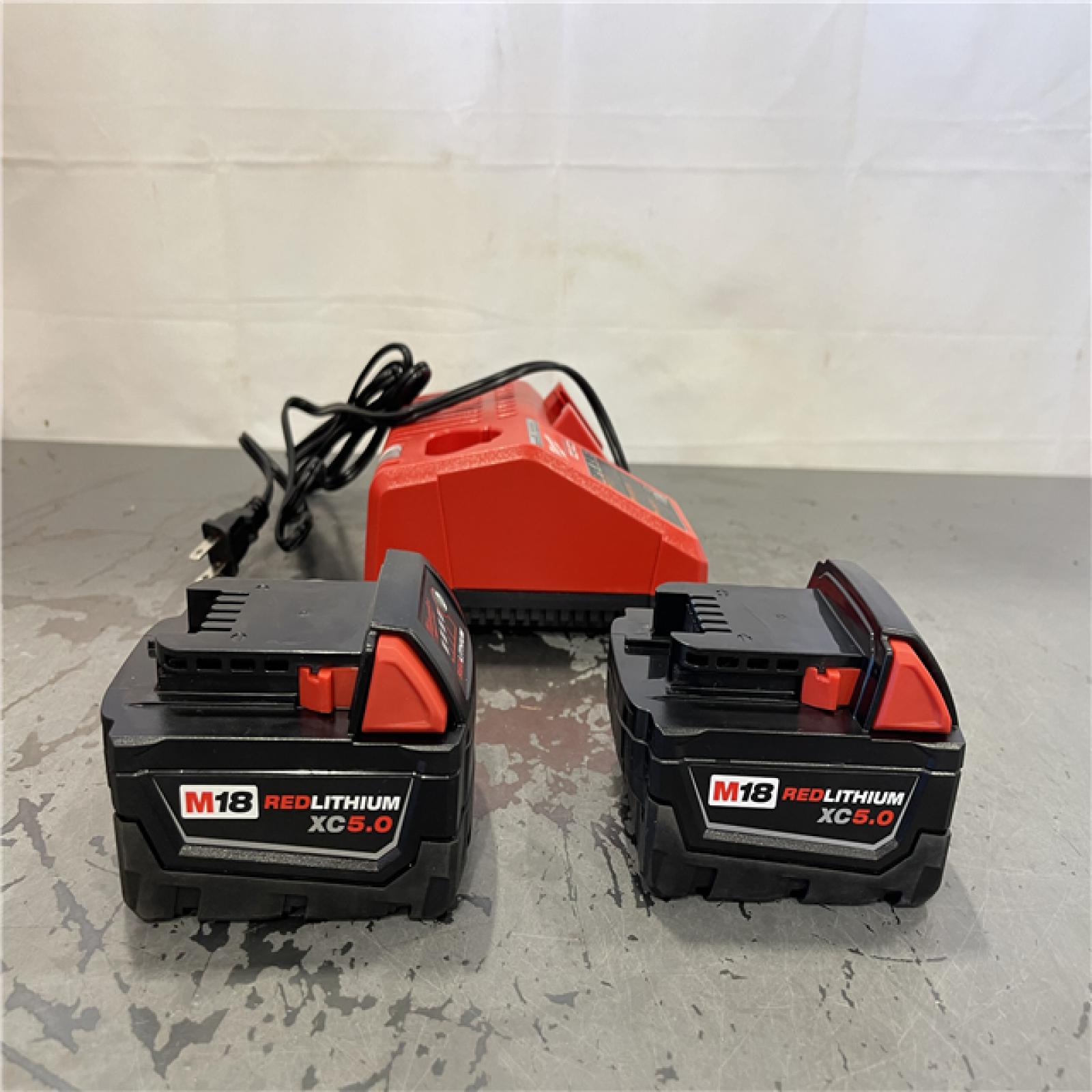 AS-IS- Milwaukee M18 18-Volt Lithium-Ion XC Starter Kit with Two 5.0Ah Batteries and Charger