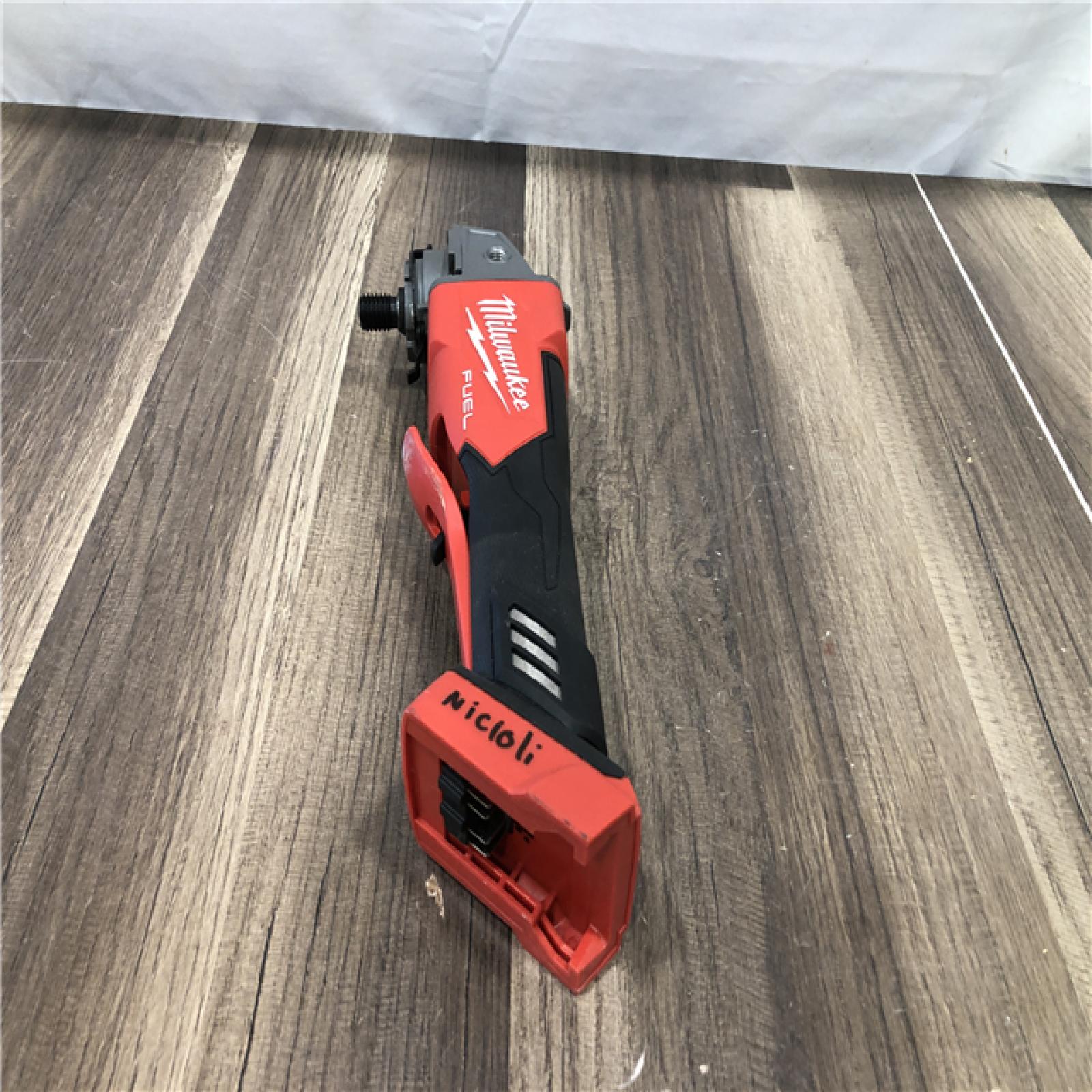 AS-IS Milwaukee FUEL 18V Lithium-Ion Brushless Cordless 4-1/2 in./5 in. Grinder w/Paddle Switch (Tool-Only)