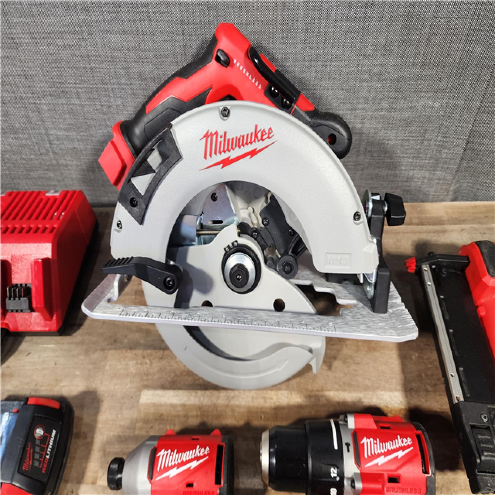 HOUSTON LOCATION - AS-IS Milwaukee M18 18-Volt Lithium-Ion Brushless Cordless Combo Kit (4-Tool) with 2-Batteries  1-Charger and Tool Bag
