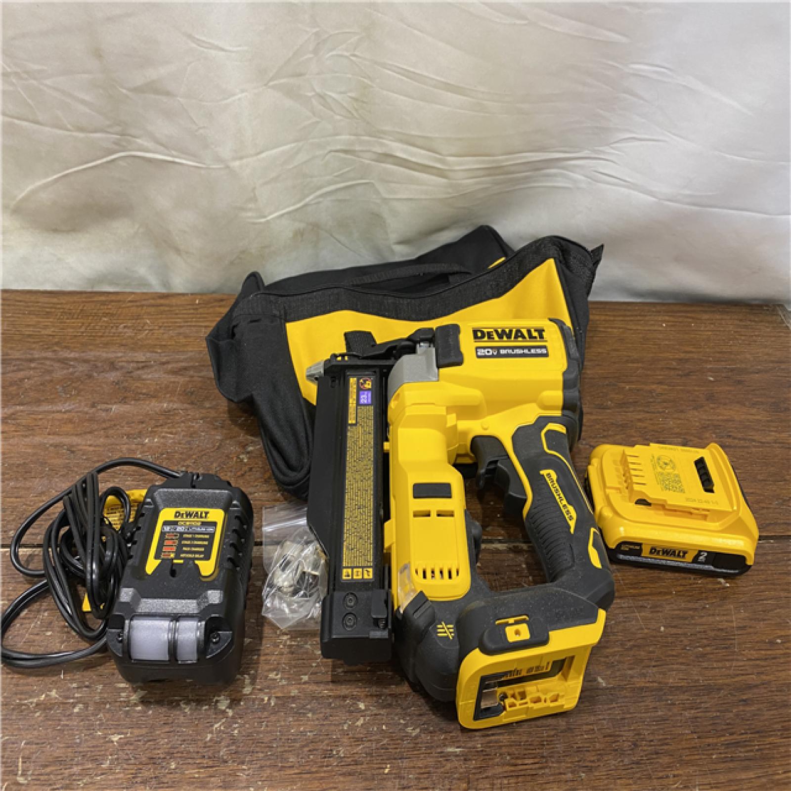 AS-IS DEWALT ATOMIC 20V MAX Lithium Ion Cordless 23 Gauge Pin Nailer Kit with 3.0Ah Battery and Charger