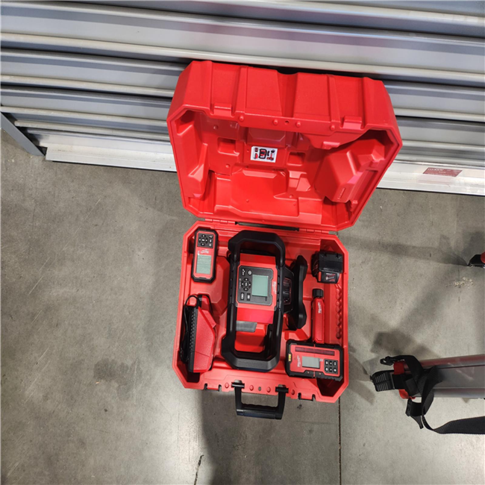 LIKE-NEW- M18 4000 Ft. Red Exterior Dual Slope Rotary Laser Level Kit with Receiver  Remote  Grade Rod and Tripod