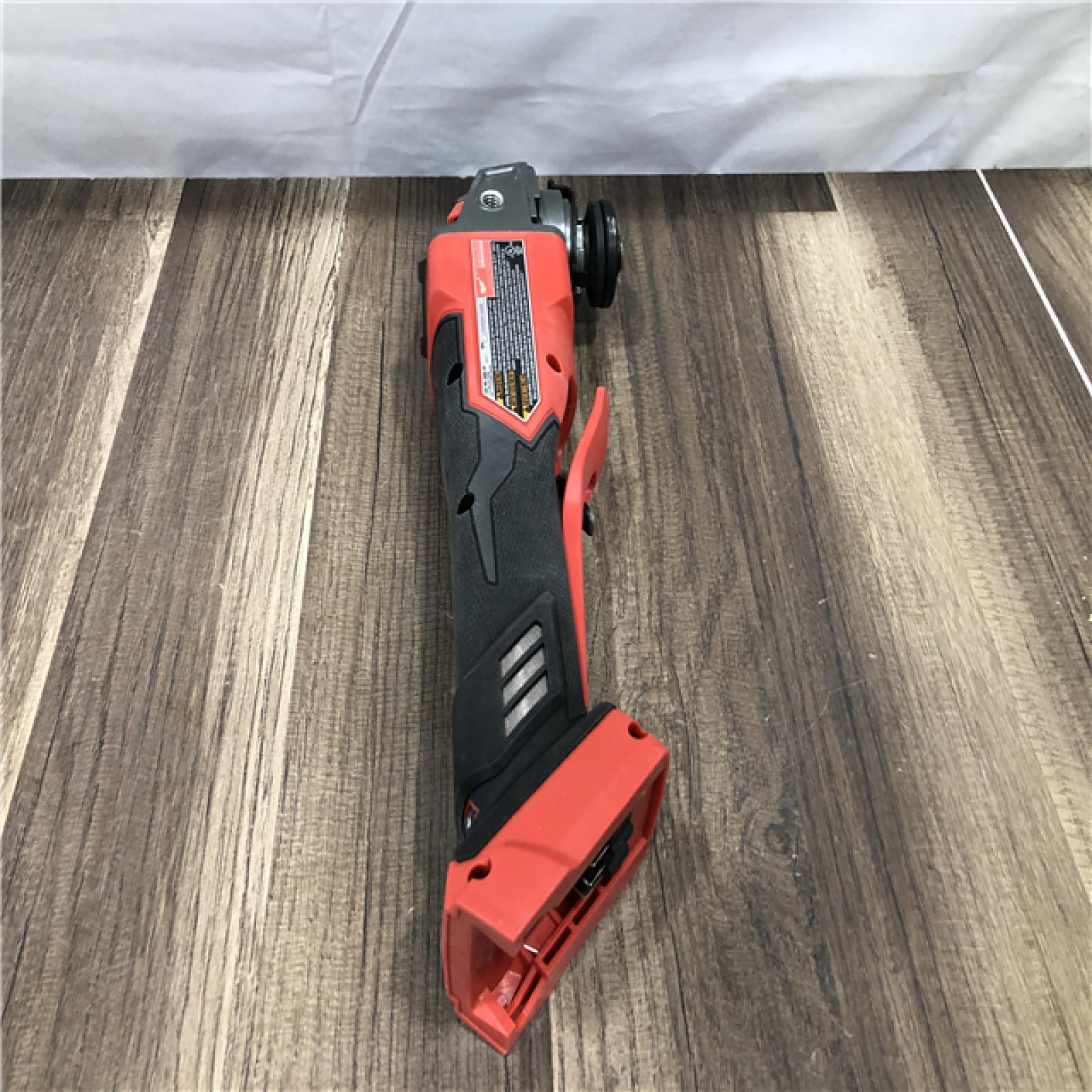 AS-IS Milwaukee FUEL 18V Lithium-Ion Brushless Cordless 4-1/2 in./5 in. Grinder with Variable Speed & Paddle Switch (Tool-Only)