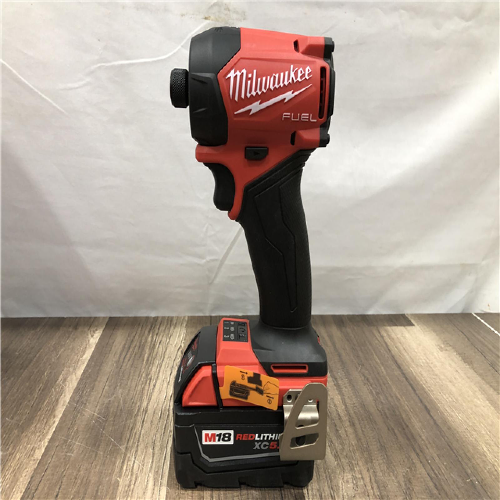 AS-IS Milwaukee FUEL SURGE 18V Lithium-Ion Brushless Cordless 1/4 in. Hex Impact Driver with (2) 5.0 Ah Battery and Charger