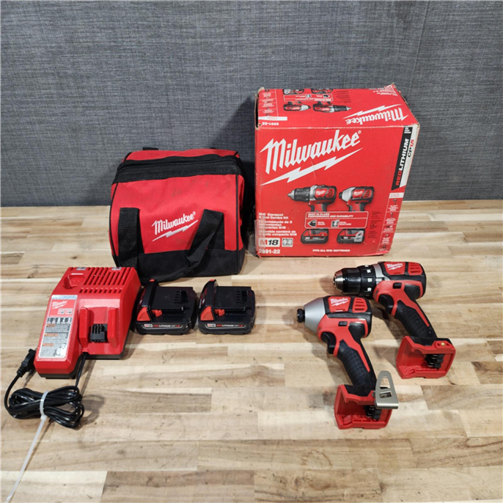 HOUSTON LOCATION - AS-IS Milwaukee 18V Lithium-Ion Cordless Drill Driver/Impact Driver Combo Kit
