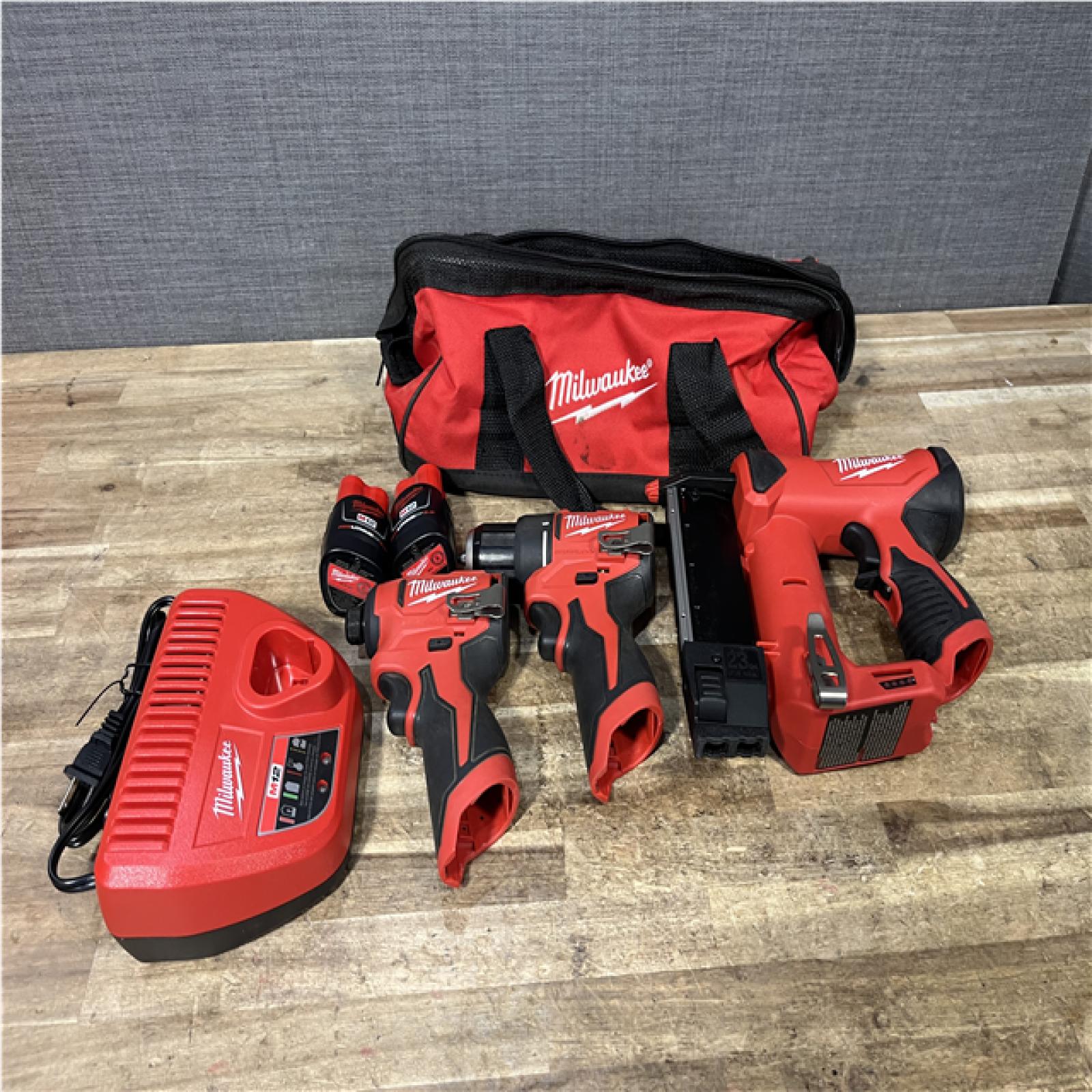 Houston Locations AS-IS Milwaukee Drill Driver and Impact Driver and Pin Nailer and Batteries QTY/2 with Charger
