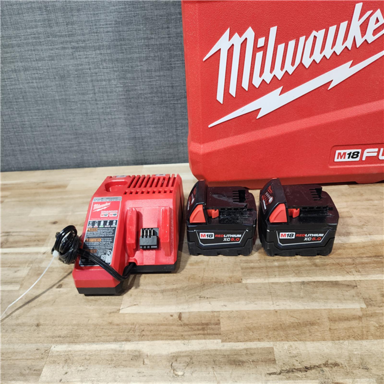 HOUSTON LOCATION - AS-IS Milwaukee FUEL 18V Lithium-Ion Brushless Cordless Hammer Drill and Impact Driver Combo Kit