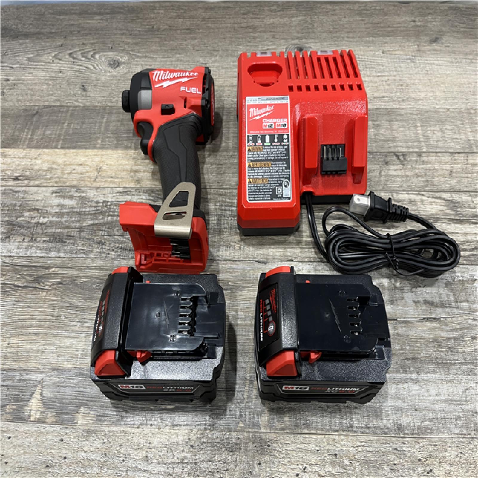 AS-IS Milwaukee FUEL 18V Lithium-Ion Brushless Cordless 1/4 in. Hex Impact Driver Kit