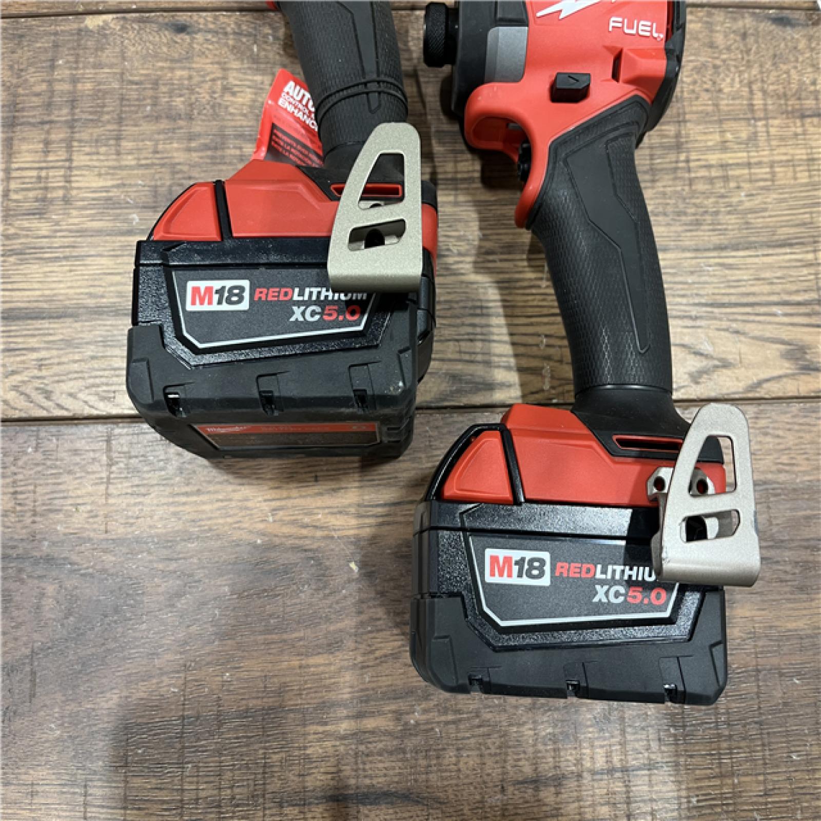 AS-IS Milwaukee M18 FUEL 18V Lithium-Ion Brushless Cordless Hammer Drill and Impact Driver Combo Kit (2-Tool) with 2 Batteries