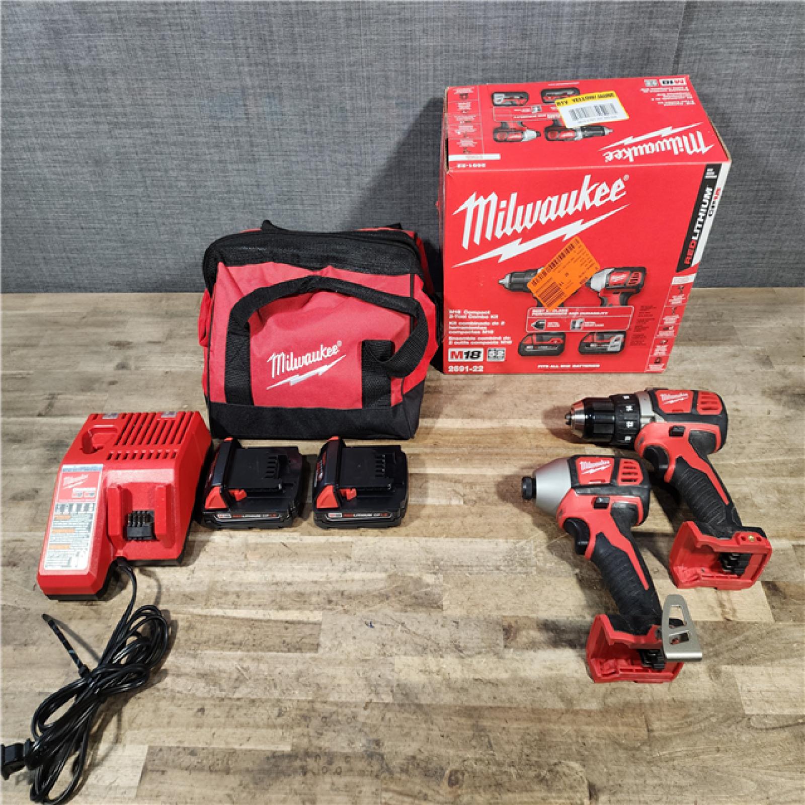 HOUSTON LOCATION - AS-IS Milwaukee 18V Lithium-Ion Cordless Drill Driver/Impact Driver Combo Kit