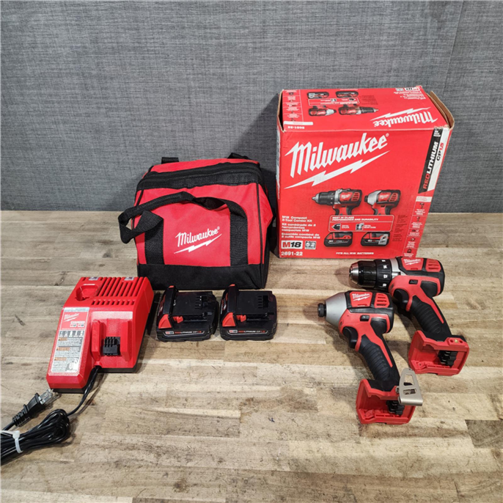 HOUSTON LOCATION - AS-IS Milwaukee 18V Lithium-Ion Cordless Drill Driver/Impact Driver Combo Kit