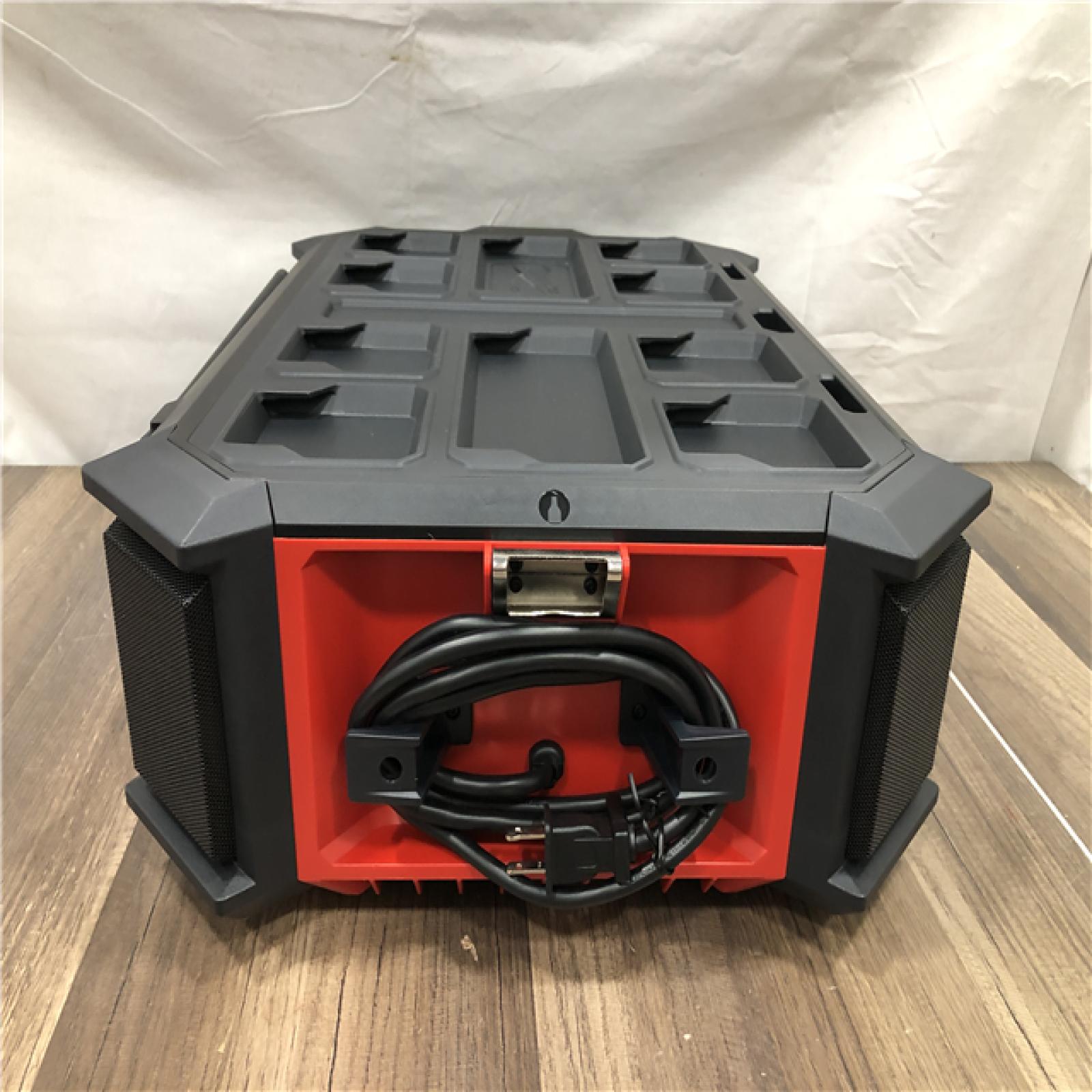AS-IS Milwaukee  Lithium-Ion Cordless PACKOUT Radio/Speaker with Built-In Charger