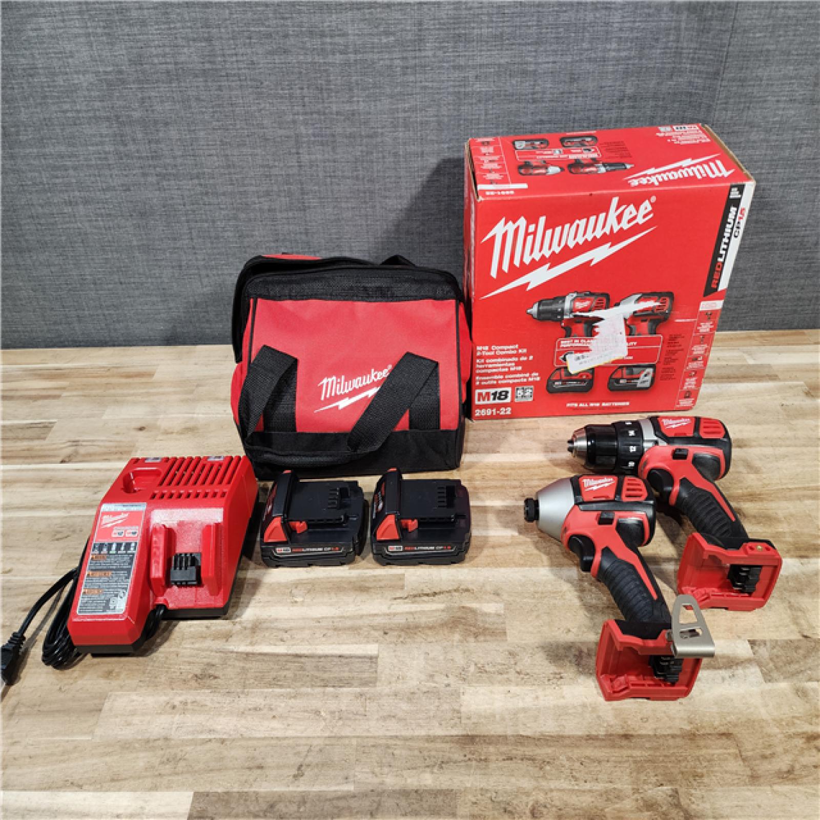 HOUSTON LOCATION - AS-IS Milwaukee 18V Lithium-Ion Cordless Drill Driver/Impact Driver Combo Kit