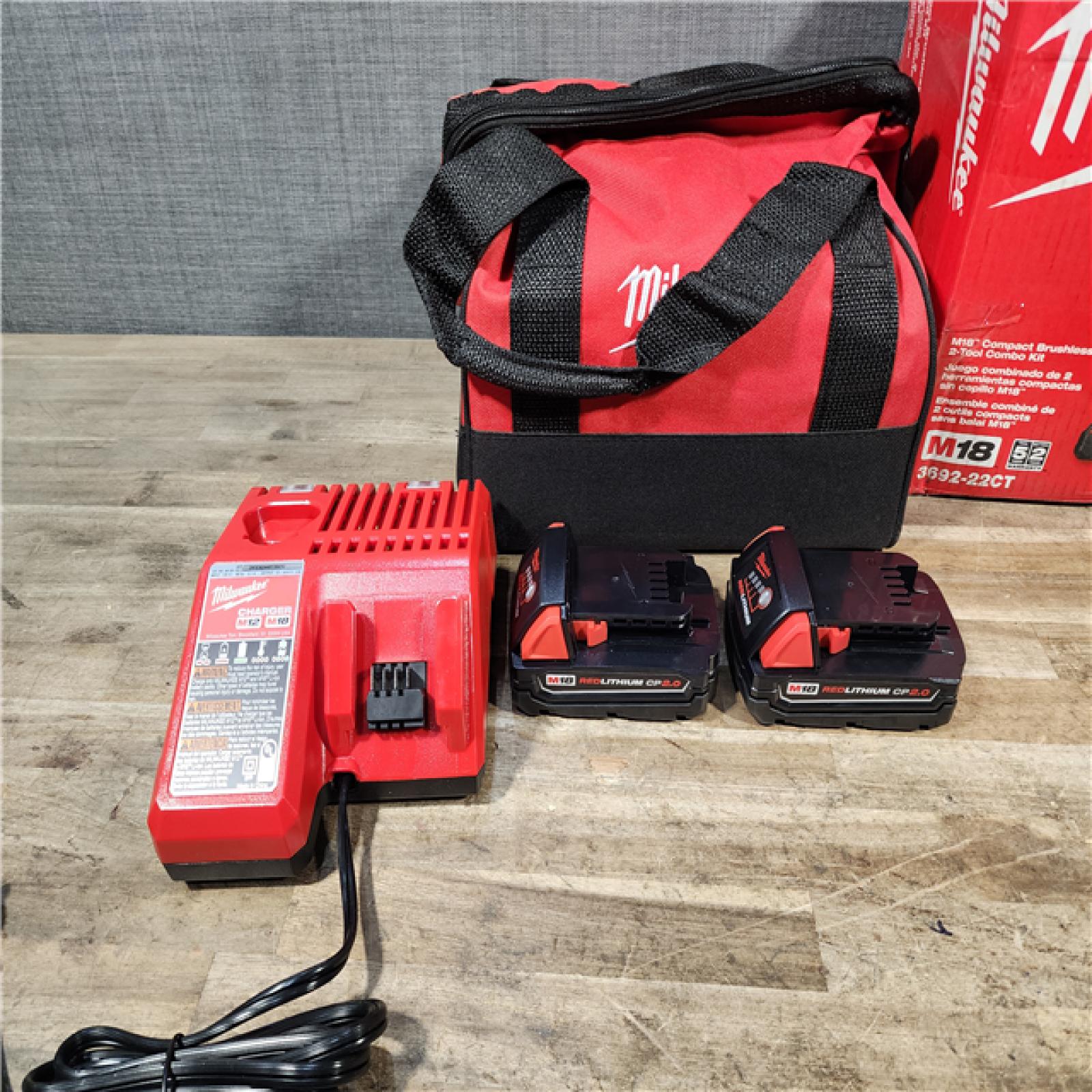 HOUSTON LOCATION - AS-IS Milwaukee M18 18V Lithium-Ion Brushless Cordless Compact Drill/Impact Combo Kit (2-Tool) W/(2) 2.0 Ah Batteries  Charger & Bag