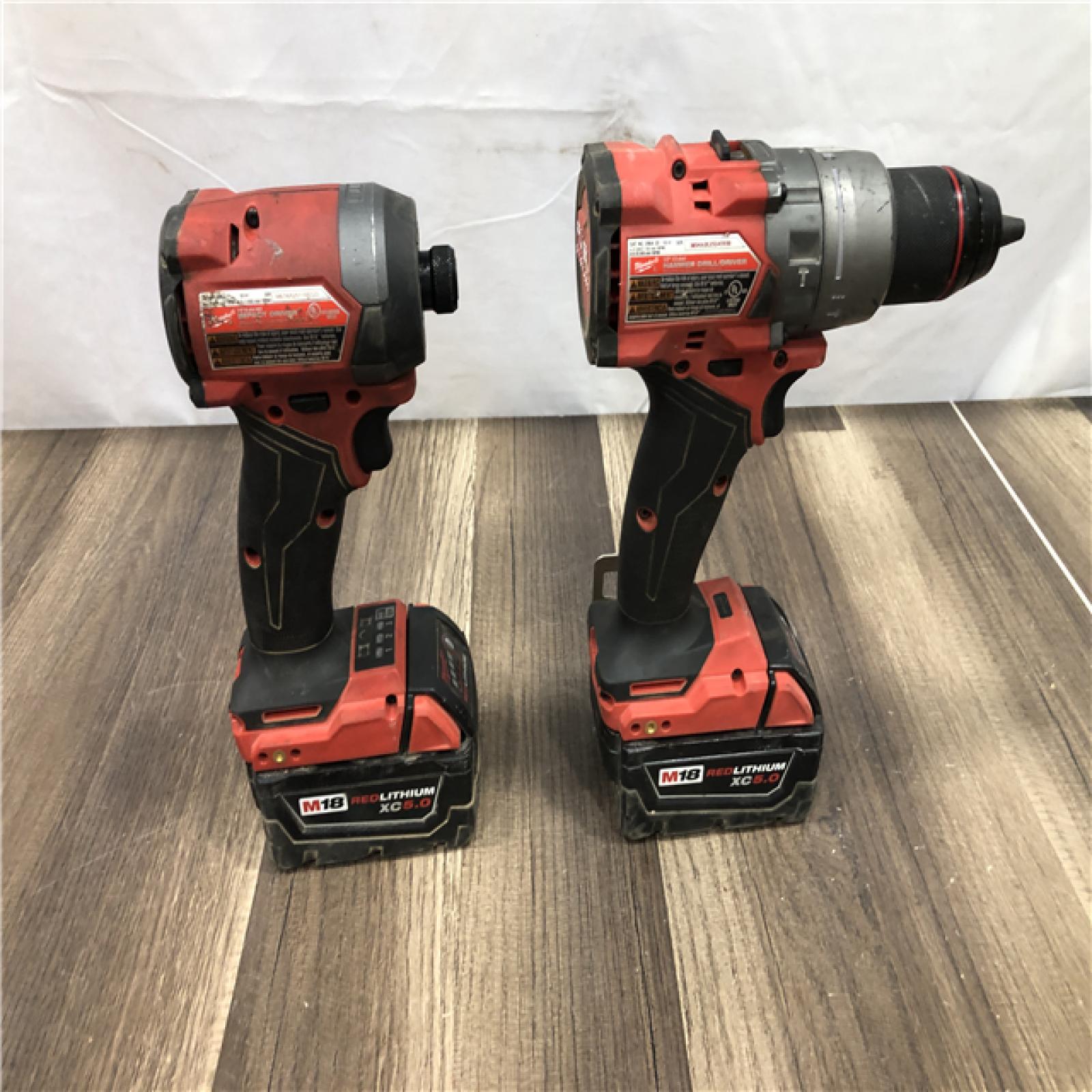 AS-IS Milwaukee FUEL 18V Lithium-Ion Brushless Cordless Hammer Drill and Impact Driver Combo Kit