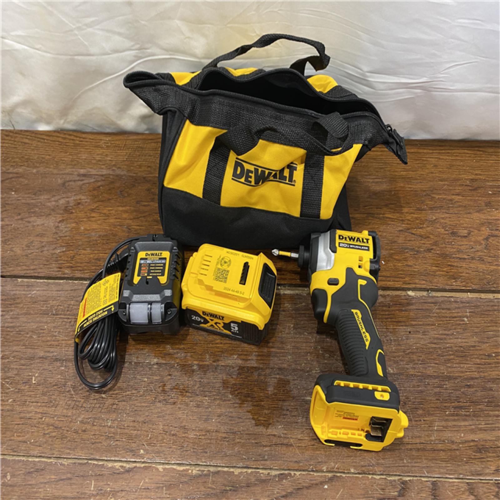 AS-IS DEWALT ATOMIC 20V MAX Lithium-Ion Cordless 1/4 in. Brushless Impact Driver Kit, 5 Ah Battery, Charger, and Bag