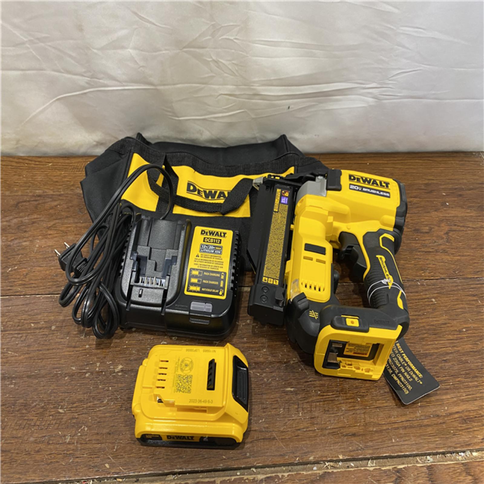 AS-IS DEWALT ATOMIC 20V MAX Lithium Ion Cordless 23 Gauge Pin Nailer Kit with 3.0Ah Battery and Charger