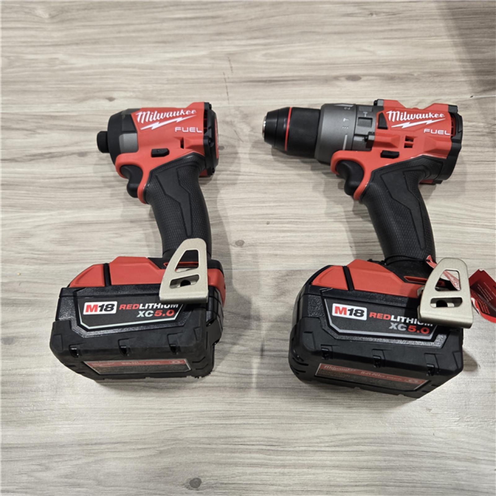 AS-IS MILWAUKEE FUEL 18V Lithium-Ion Brushless Cordless Hammer Drill and Impact Driver Combo Kit (2-Tool) with 2 Batteries