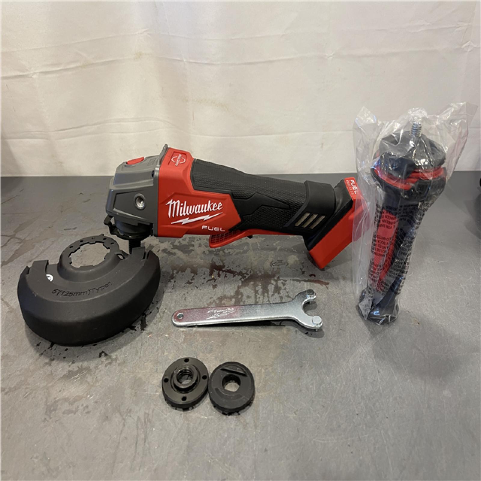 AS-IS - Milwaukee M18 FUEL 18V Lithium-Ion Brushless Cordless 4-1/2 in./5 in. Grinder w/Paddle Switch