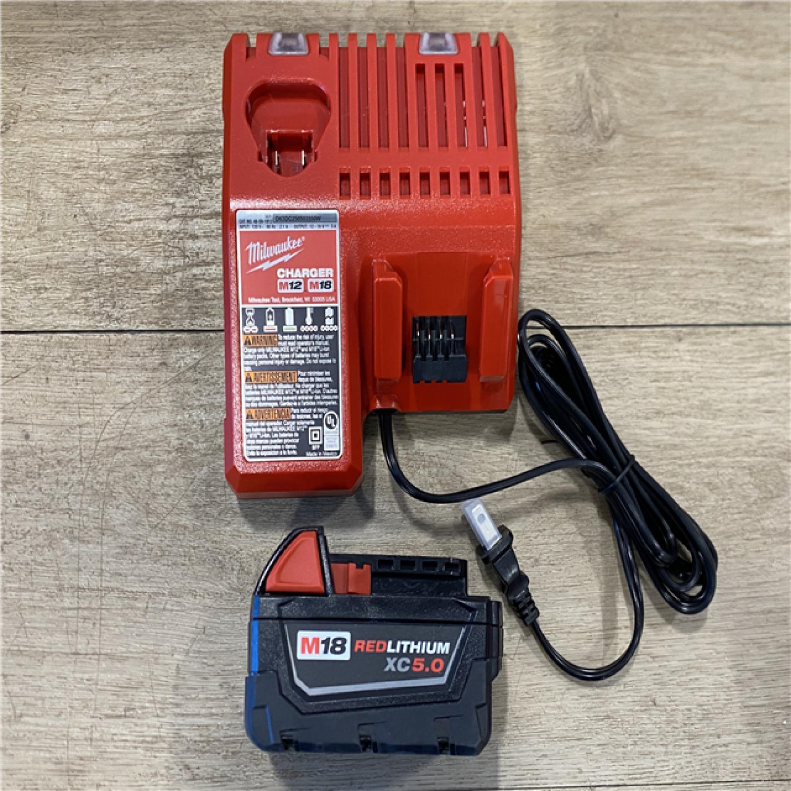 AS-IS Milwaukee  M18 18-Volt Lithium-Ion Brushless Cordless 1/4 in. Compact Impact Driver with M18 5.0Ah Battery and Charger