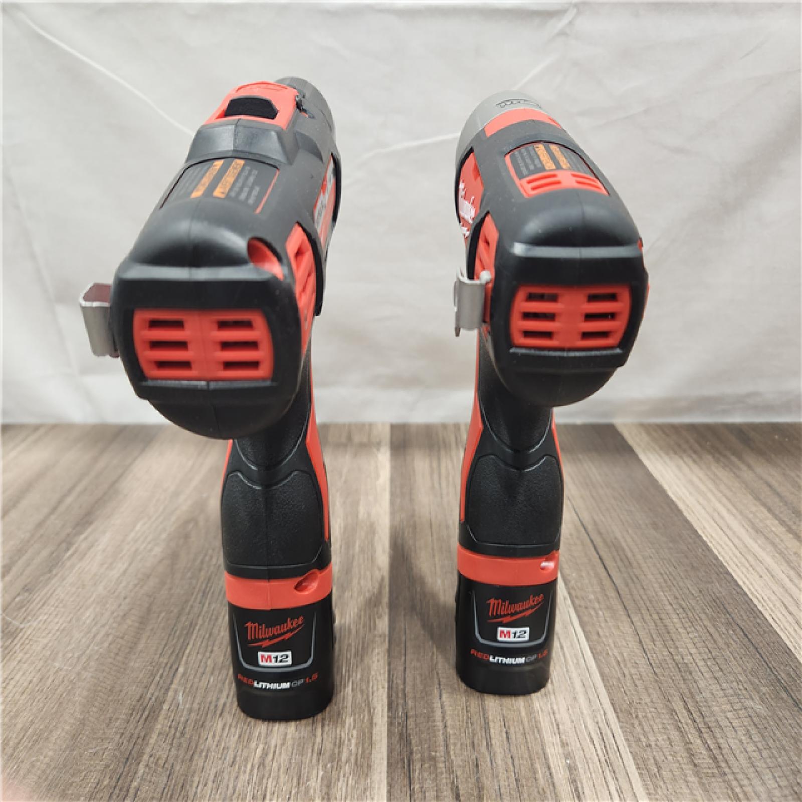 AS-IS- Milwaukee M12 Cordless Combination 3/8  Drill / Driver and 1/4  Hex Impact Driver Dual Power Tool Kit (2 Lithium Ion Batteries  Charger  and B