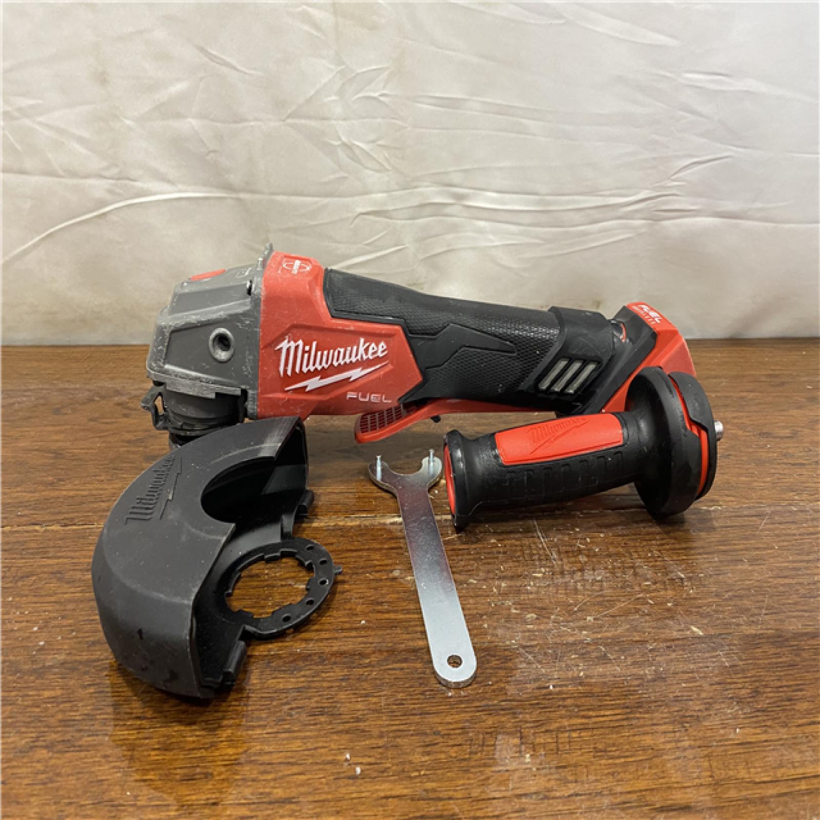 AS-IS M18 FUEL 18V Lithium-Ion Brushless Cordless 4-1/2 in./5 in. Grinder with Variable Speed & Paddle Switch (Tool-Only)