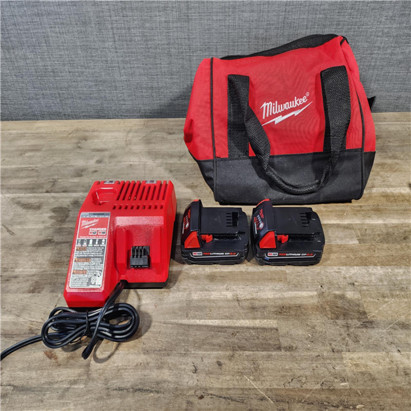 HOUSTON LOCATION - AS-IS Milwaukee M18 18V Lithium-Ion Brushless Cordless Compact Drill/Impact Combo Kit (2-Tool) W/(2) 2.0 Ah Batteries  Charger & Bag
