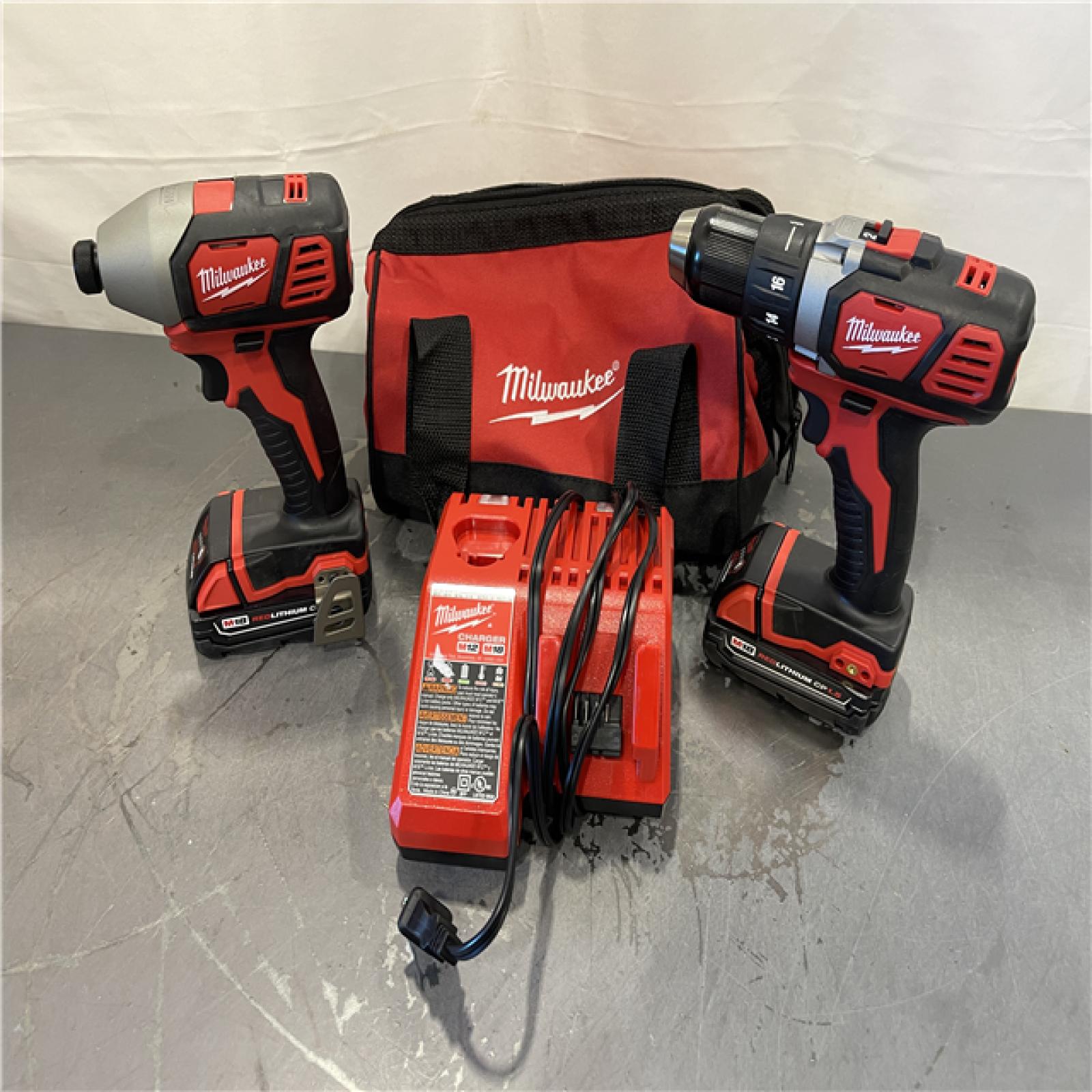 AS-IS - Milwaukee M18 18V Lithium-Ion Cordless Drill Driver/Impact Driver Combo Kit (2-Tool)