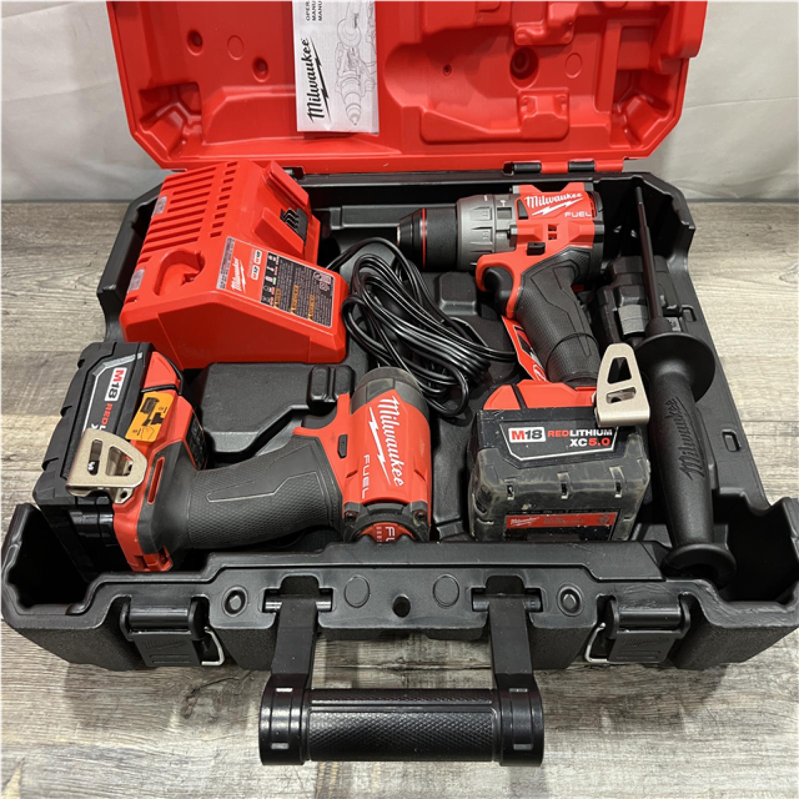 AS-IS Milwaukee FUEL 18V Lithium-Ion Brushless Cordless Hammer Drill and Impact Driver Combo Kit
