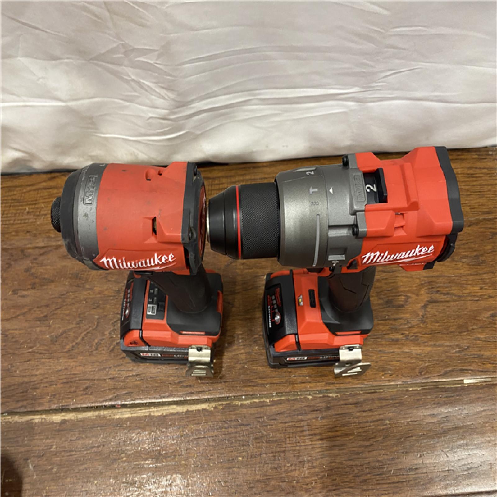 AS-IS MILWAUKEE M18 FUEL 18V Lithium-Ion Brushless Cordless Hammer Drill and Impact Driver Combo Kit (2-Tool) with 2 Batteries