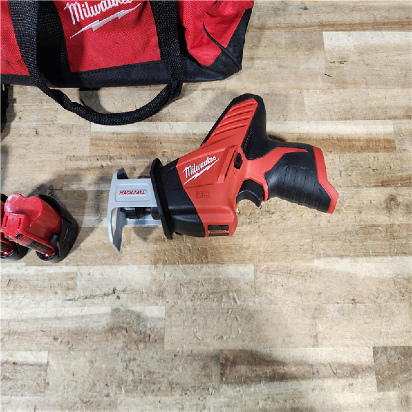 HOUSTON LOCATION - AS - IS Milwaukee M12 12-Volt Lithium-Ion HACKZALL Cordless Reciprocating Saw W/ (2) 1.5Ah Batteries  Charger and Bag