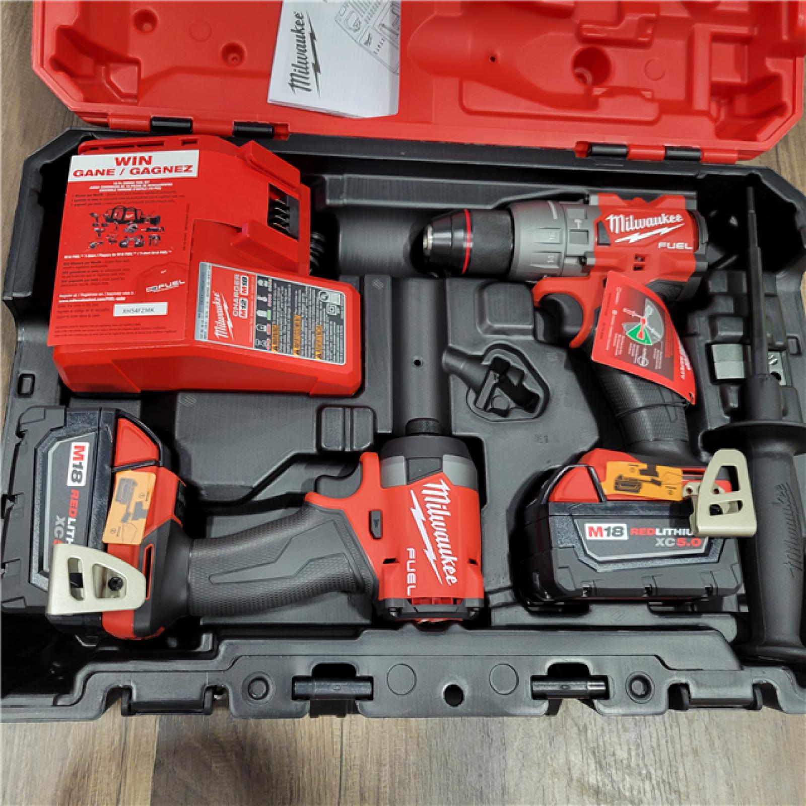 AS-IS Milwaukee M18 FUEL 18V Lithium-Ion Brushless Cordless Hammer Drill and Impact Driver Combo Kit (2-Tool) with 2 Batteries