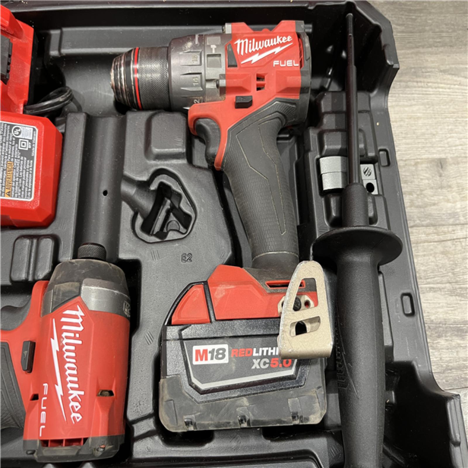 AS-IS Milwaukee FUEL 18V Lithium-Ion Brushless Cordless Hammer Drill and Impact Driver Combo Kit