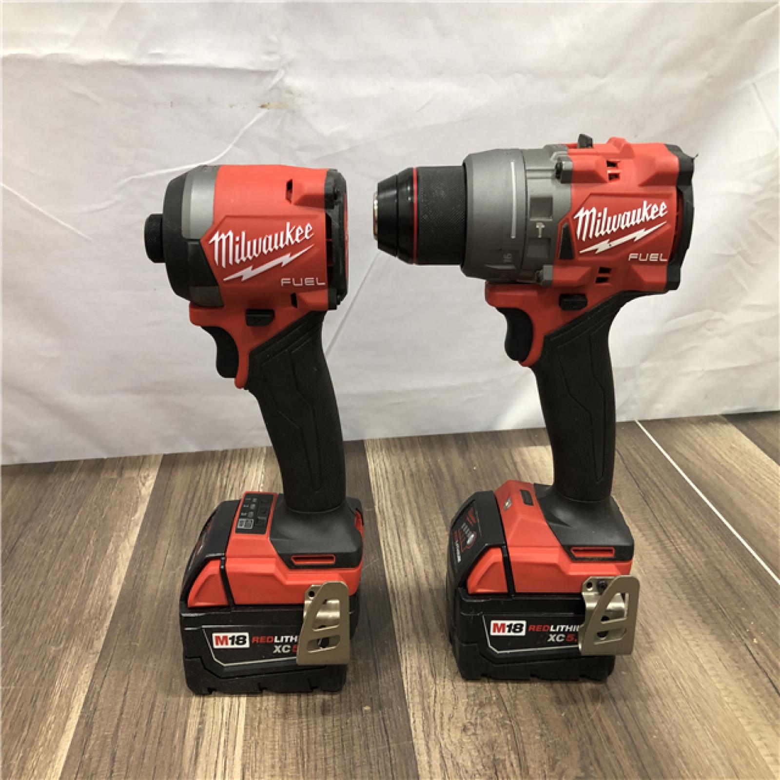 AS-IS Milwaukee FUEL 18V Lithium-Ion Brushless Cordless Hammer Drill and Impact Driver Combo Kit