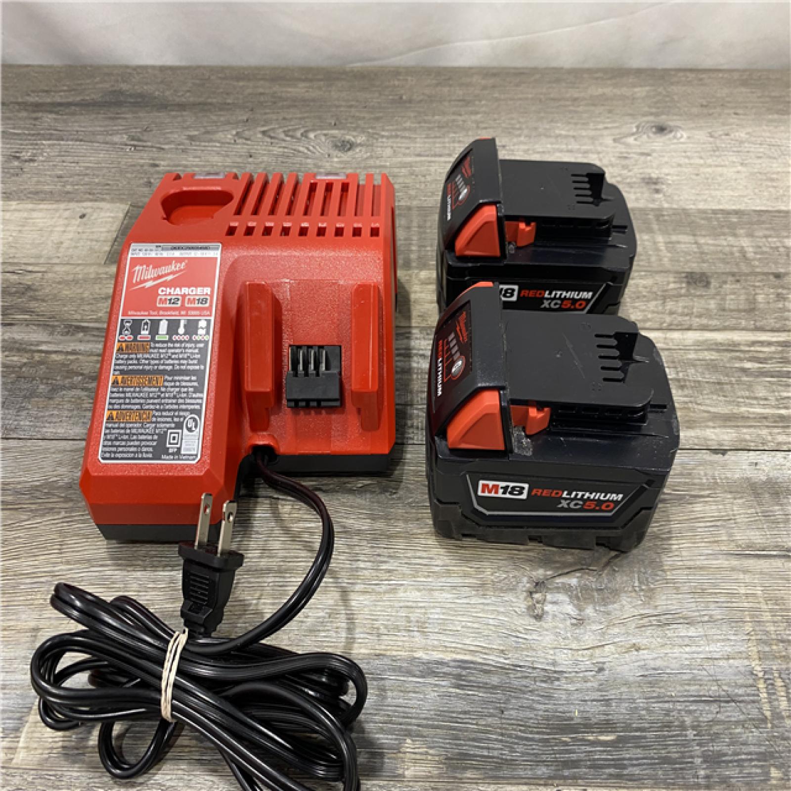 AS-IS Milwaukee 18-Volt Lithium-Ion XC Starter Kit with Two 5.0Ah Batteries and Charger