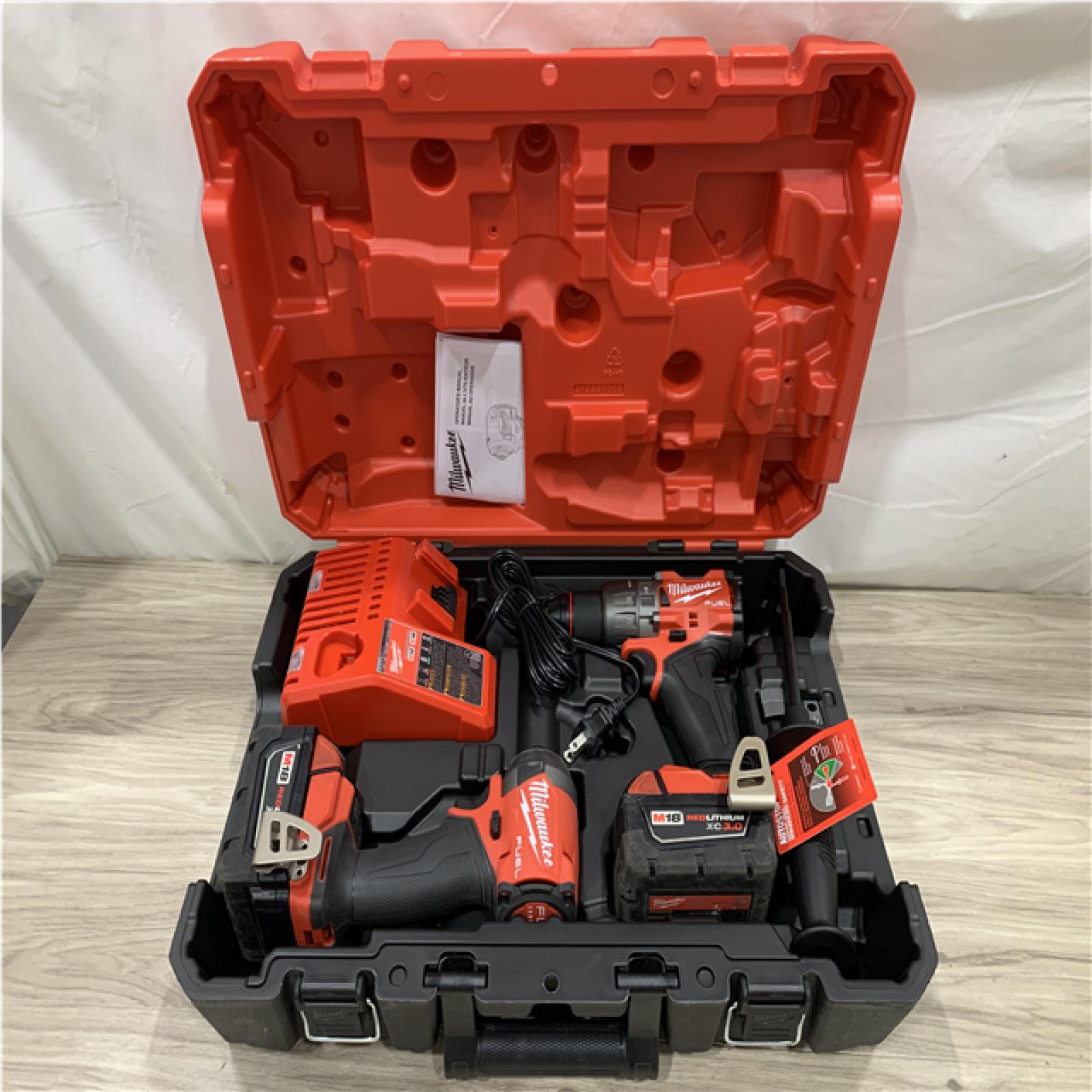 AS-IS Milwaukee FUEL 18V Lithium-Ion Brushless Cordless Hammer Drill and Impact Driver Combo Kit