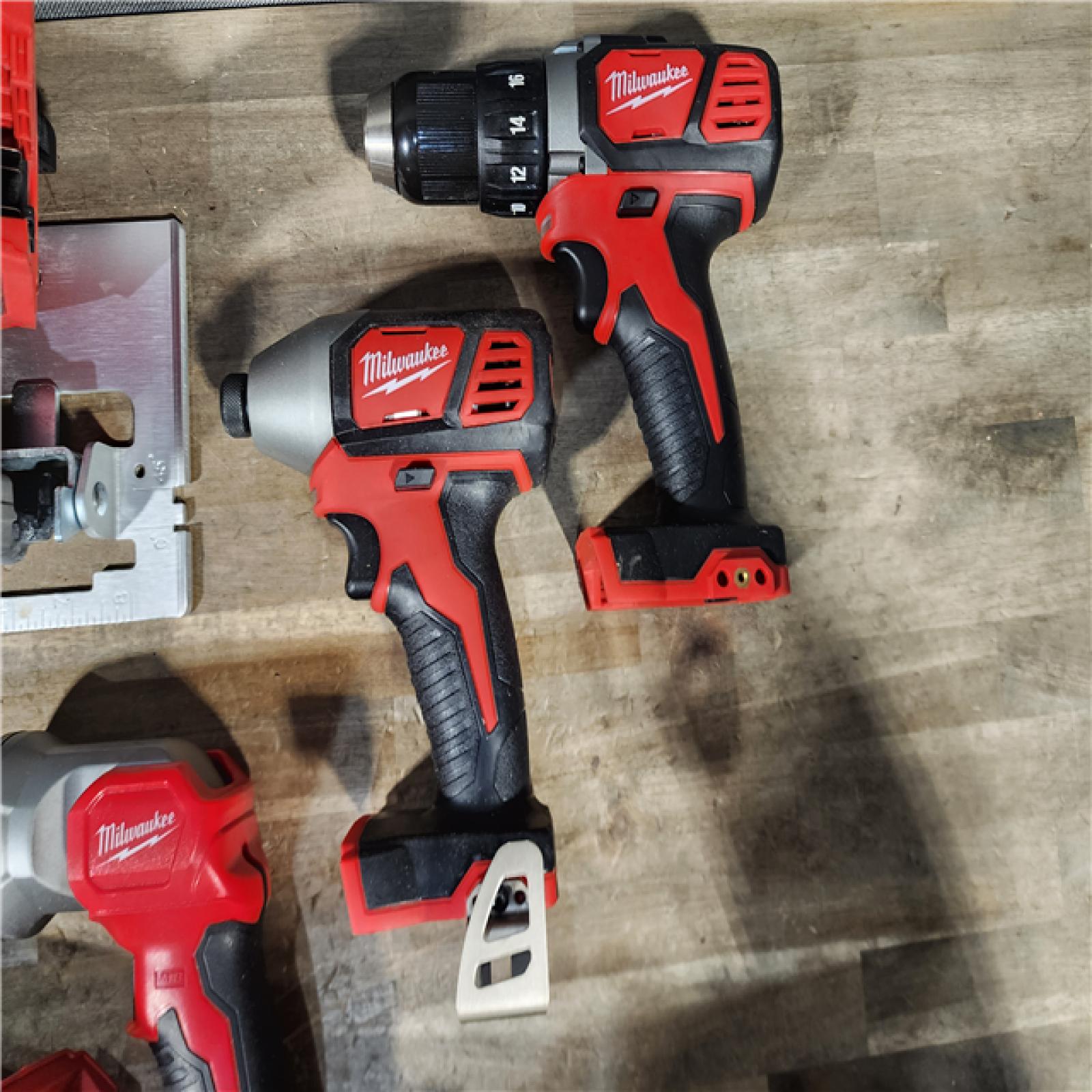 HOUSTON LOCATION - AS-IS Milwaukee M18 18-Volt Lithium-Ion Cordless Combo Tool Kit (5-Tool) with (1) 3.0Ah and (1) 1.5Ah Battery  (1) Charger  (1) Tool Bag