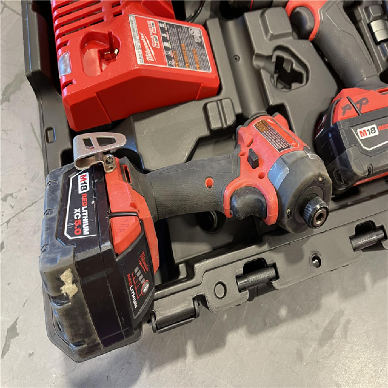 AS-IS - Milwaukee M18 FUEL 18V Lithium-Ion Brushless Cordless Hammer Drill and Impact Driver Combo Kit