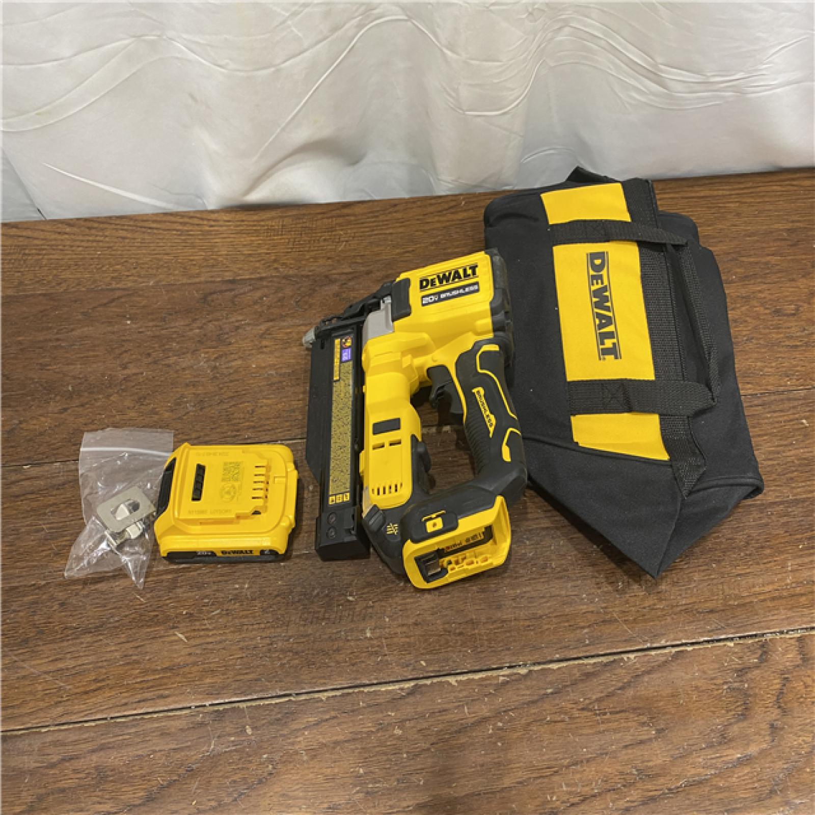 AS-IS DEWALT ATOMIC 20V MAX Lithium Ion Cordless 23 Gauge Pin Nailer Kit with 3.0Ah Battery and Charger