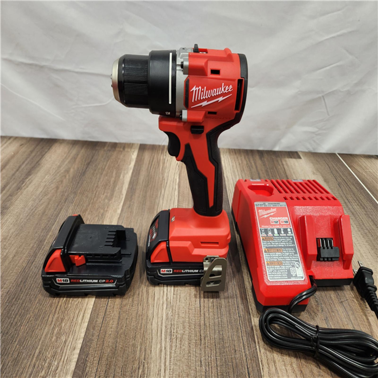AS-IS -  Milwaukee M18 18V Lithium-Ion Brushless Cordless 1/2 in. Compact Drill/Driver Kit with Two 2.0 Ah Batteries, Charger and Case