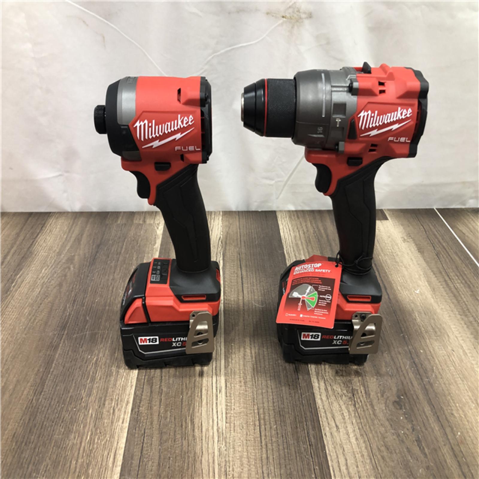 AS-IS Milwaukee FUEL 18V Lithium-Ion Brushless Cordless Hammer Drill and Impact Driver Combo Kit