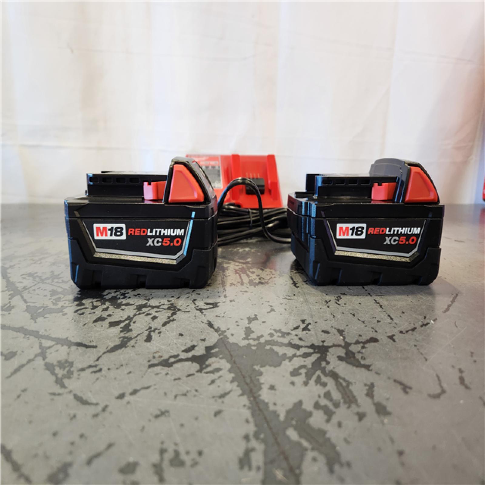 AS-IS- Milwaukee 18-Volt Lithium-Ion XC Starter Kit with Two 5.0Ah Batteries and Charger